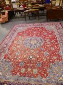 A PERSIAN ROOMSIZE CARPET OF CLASSIC DESIGN.