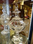 THREE IRISH STYLE LIDDED GLASS VASES.