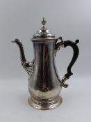 AN 18th CENTURY HALLMARKED SILVER COFFEE POT, DATED 1763 LONDON, ENGRAVED WITH A STAGS HEAD CREST.