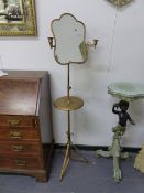 A LATE VICTORIAN FREESTANDING SHAVING MIRROR WITH CANDLE SCONCES.