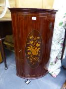 A MAHOGANY AND INLAID BOW FRONT CORNER CABINET WITH PAINTED SHELVED INTERIOR. W.51 x H.84cms
