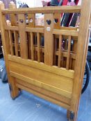 A PAIR OF ARTS AND CRAFTS OAK SINGLE BEDS. W.92.5cms.