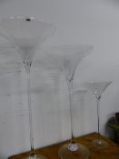 THREE LARGE CLEAR GLASS "MARTINI" TYPE VASES. LARGEST H.119cms (3)