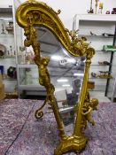A FINE 19th.C.GILT BRONZE EASEL BACK MIRROR OF HARP FORM SURMOUNTED BY CHERUBS AND MUSICAL