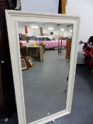 A PIER MIRROR WITH WHITE PAINTED MOULDED FRAME. 158 x 89cms.