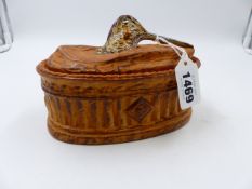 A FRENCH RUSTIC PORCELAIN PIE DISH AND COVER, THE COVER DECORATED WITH A STYLIZED WOODCOCK HEAD. L.