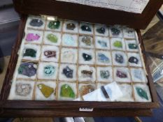 AN INTERESTING GEM STONE COLLECTION CONTAINED IN PALMWOOD BOOK FORM BOX.