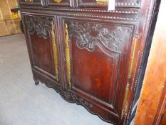 A 19th.C.FRENCH OAK COUNTRY SIDE CABINET WITH CARVED DECORATION. W.132 x H.114cms.