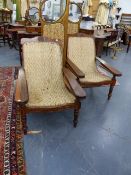 A GOOD PAIR OF LARGE ANTIQUE COLONIAL TEAK PLANTATION CHAIRS WITH ORIGINAL RATTAN SEATS.