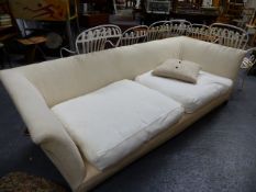 A LARGE 3 SEAT COUNTRY HOUSE SOFA WITH FEATHER CUSHIONS