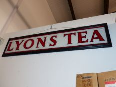 A RARE GLASS ADVERTISING PANEL FOR LYON'S TEA.
