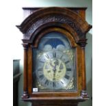 AN 18th.C.DUTCH WALNUT CASED LONGCASE CLOCK WITH FRET PANEL HOOD OVER SLENDER DOOR WITH BULLSEYE