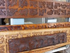 A GROUP OF ANTIQUE AND LATER CARVED TREEN SWEET MOULDS.