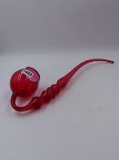 A CRANBERRY GLASS PIPE. L.42cms.