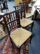 A SET OF SIX LANCASHIRE SPINDLE BACK RUSH SEAT SIDE CHAIRS.