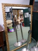 A LARGE GILT FRAMED WALL MIRROR. 154 x 106cms.