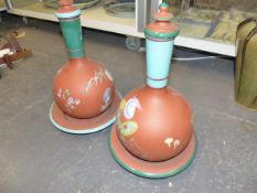 A PAIR OF TERRACOTTA BOTTLE VASES WITH STANDS.