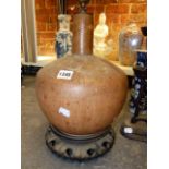 AN UNUSUAL ORIENTAL POTTERY BOTTLE FORM VASE WITH FAUX GOURD GLAZE MOUNTED AS A LAMP ON HARDWOOD