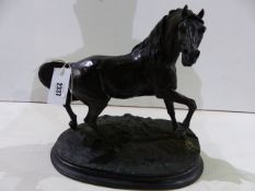 A BRONZED RESIN FIGURE OF A STALLION AFTER P.J.MENE. H.32cms.