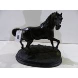 A BRONZED RESIN FIGURE OF A STALLION AFTER P.J.MENE. H.32cms.