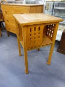 AN INTERESTING ARTS AND CRAFTS STYLE SCOTTISH SCHOOL SMALL OAK TABLE BOOKCASE WITH PIERCED PANEL