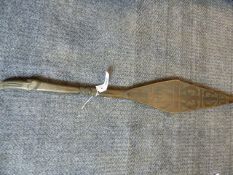 A NEW ZEALAND MAORI CEREMONIAL PADDLE WITH CARVED AND MOTHER OF PEARL INLAID DECORATION. L.85cms.