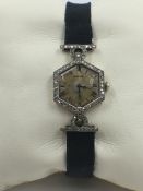 A FRENCH CARTIER ART DECO HEXAGONAL SHAPE PRECIOUS WHITE METAL AND DIAMOND MECHANICAL SWISS