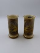 A PAIR OF ROYAL WORCESTER CYLINDRICAL VASES PAINTED WITH PHEASANTS AND WATERFALLS BY JAMES