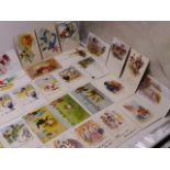 A LARGE POSTCARD ALBUM CONTAINING NUMEROUS REAL PHOTO CARDS, HUMEROUS AND SAUCY CARDS, A PART SET OF