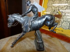 AN EARLY 20th.C.SILVER PLATED FIGURE OF A RACEHORSE OVER FENCE AND TWO LATER CAST FIGURES OF