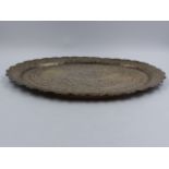 AN INDO PERSIAN WHITE METAL DECORATED TRAY. APPROXIMATE MEASURMENTS 33.5cms X 25.5cms.