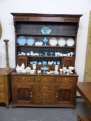 AN 18th.C.OAK DRESSER AND PLATE RACK. W.156 x H.222cms.