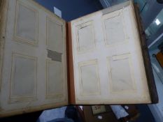 A 19th.C.PHOTOGRAPH ALBUM WITH CLOCKWORK MUSICAL MOVEMENT.