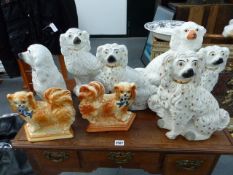 THREE PAIRS OF STAFFORDSHIRE SPANIELS AND ONE OTHER. (7)