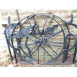 AN IMPRESSIVE PAIR OF LARGE GARDEN GATES CONSTRUCTED FROM VINTAGE FARM MACHINERY.