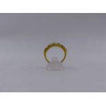 AN 18ct YELLOW GOLD "S" SET BRILLIANT CUT DIAMOND HALF ETERNITY RING, APPROXIMATE TOTAL DIAMOND