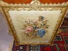 A PAIR OF VICTORIAN FLORAL NEEDLEWORK PANELS IN ELABORATE GILT FRAMES TOGETHER WITH ANOTHER OF A