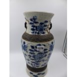 A CHINESE BLUE AND WHITE CRACKLE GLAZE TWIN HANDLE BALUSTER VASE WITH DRAGON DECORATION. IMPRESSED