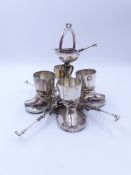 AN ELECTROPLATED FOUR PIECE EGG CUP STAND WITH MATCHING SPOONS WITH A JOCKEY THEME.