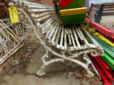 A VICTORIAN GARDEN BENCH WITH TRIPLE CAST IRON SUPPORTS OF ENTWINED BRANCH FORM IN THE MANNER OF