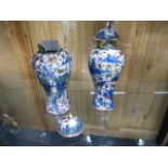A NEAR PAIR OF CHINESE BLUE AND WHITE COVERED VASES OF LOBED FORM WITH CLOBBERED FAMILLE ROSE