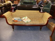 A WM.IV.MAHOGANY SCROLL ARM SETTEE ON TURNED REEDED LEGS AND MATCHING BRASS CASTERS. APPROX W.