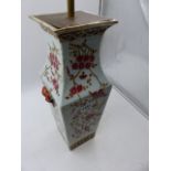 A CHINESE FAMILLE ROSE SQUARE FORM VASE WITH MASK HANDLES NOW MOUNTED AS A LAMP. OVERALL H.50cms.