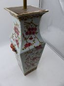 A CHINESE FAMILLE ROSE SQUARE FORM VASE WITH MASK HANDLES NOW MOUNTED AS A LAMP. OVERALL H.50cms.