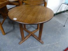 A VINTAGE WALNUT OCCASIONAL TABLE IN THE MANNER OF PETER WAALS.