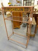 A RARE MICHELIN WORKSHOP TYRE STAND WITH Mr. BIBENDUM LOGO.