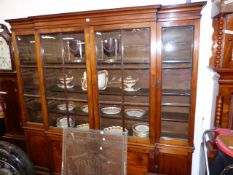 AN 18th.C.GEORGIAN FRUITWOOD BREAKFRONT BOOKCASE WITH FOUR GLAZED PANEL DOORS OVER CONFORMING