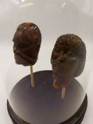 TWO RARE NEW ZEALAND MAORI GUM HEADS ONE OF A WARRIOR WITH TATTOOED FACE, THE OTHER OF A FEMALE, NOW