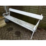 AN ANTIQUE GARDEN BENCH WITH CAST IRON ENDS.