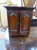A 19th.C.OAK TABLE CABINET WITH FOUR DRAWER INTERIOR. H.36cms.